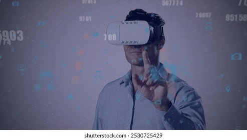 Image of data processing over men using vr headset. Global business, finances, data processing and digital interface concept digitally generated image.