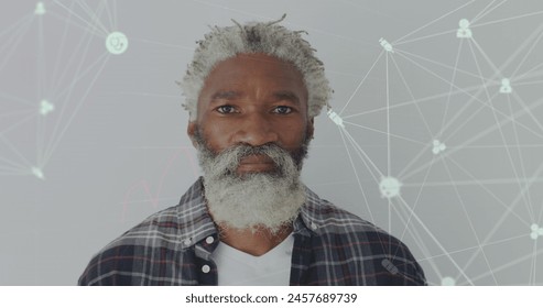 Image of data processing over senior african american man smiling. Global business and digital interface concept digitally generated image. - Powered by Shutterstock - Get 15% off with code: PIKWIZARD15
