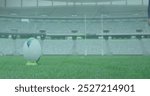 Image of data processing and scope scanning over african american rugby player at stadium. Global sport, computing and digital interface concept digitally generated image.