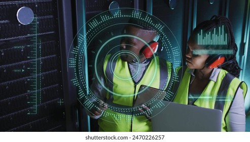 Image of data processing and scope scanning over african american workers in server room. Global business, security and digital interface concept digitally generated image.