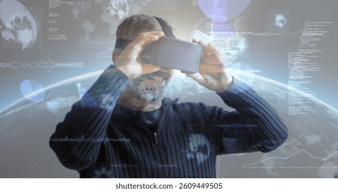 Image of data processing and statistics recording screens over man wearing vr headset. global data processing, communication and global technology concept digitally generated image.