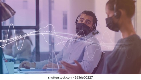 Image of data processing with white lines over diverse business people with face masks. Global business, finance and data processing during covid 19 pandemic concept digitally generated image.
