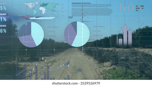 Image of data processing, world map and diagrams over landscape. Global business, nature and digital interface concept, digitally generated image.