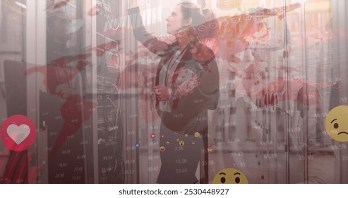 Image of data processing and world map over caucasian female worker in server room. Global technology and digital interface concept digitally generated image.