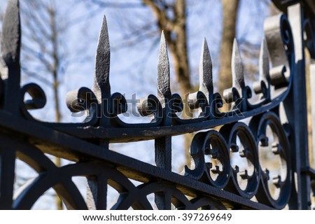 Image of a decorative cast iron fence in gothic style and for design background