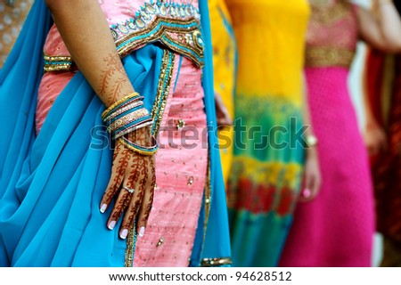 Image detail shot of henna tattoo and saris