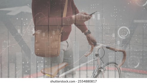 Image of diagrams and data processing over african american man using smartphone in city. Business, technology and digital interface concept digitally generated image.