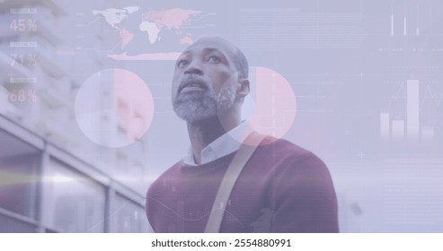 Image of diagrams and data processing over african american man walking in city. Business, technology and digital interface concept digitally generated image. - Powered by Shutterstock