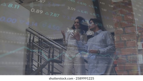 Image of diagrams and stock market over diverse colleagues talking in office. Global business and digital interface concept digitally generated image.