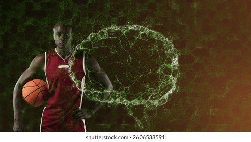Image of digital brain spinning over male basketball player holding ball. global sports, fitness and data processing concept digitally generated image.