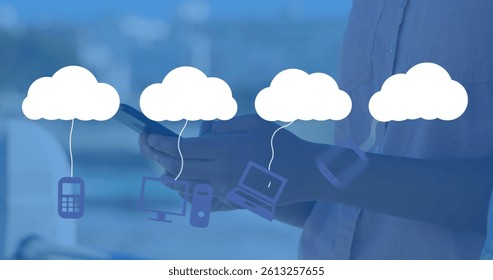 Image of digital clouds with icons over man using smartphone. global networks, connections, data storage and digital interface concept digitally generated image.