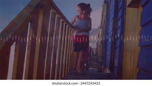 Image of digital data processing and glowing lights over caucasian girl on the beach. Global connections, data processing and digital interface concept digitally generated image. - Powered by Shutterstock