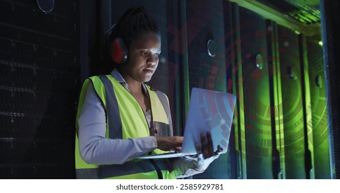 Image of digital data processing over african american it female engineer by computer servers. Global connections, computing and data processing concept digitally generated image.