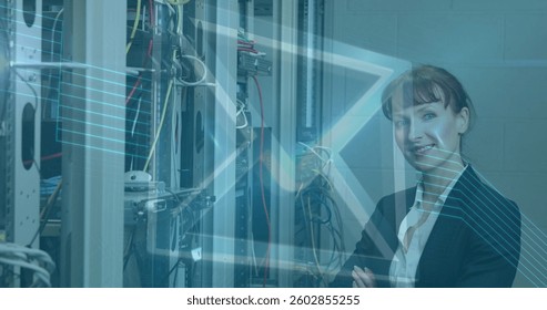 Image of digital envelope icon over woman in tech room with computer servers. digital interface global connection and communication concept digitally generated image.