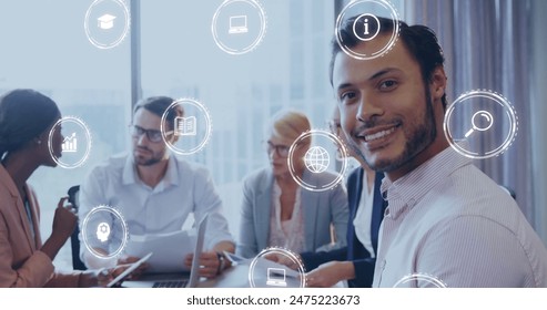 Image of digital icons and data processing over diverse business people in office. Global business, finances, computing and data processing concept digitally generated image.