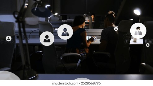 Image of digital icons with data processing over diverse business people in office. Global business, finances, computing and data processing concept digitally generated image.