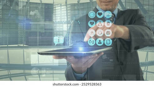 Image of digital icons and financial data processing over businessman holding tablet. global finances, business, digital interface and data processing concept digitally generated image. - Powered by Shutterstock - Get 15% off with code: PIKWIZARD15