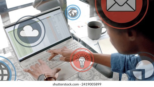 Image of digital icons processing over african american businessman in office. Global finance, business, connections, computing and data processing concept digitally generated image.