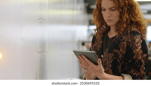 Image of digital interface data recording on screen with woman using digital tablet. Global digital online concept digitally generated image.