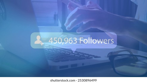 Image of digital interface Followers text and people icon with growing numbers on blue speech bubble over woman using smartphone and laptop. Global social media network digitally generated image. - Powered by Shutterstock