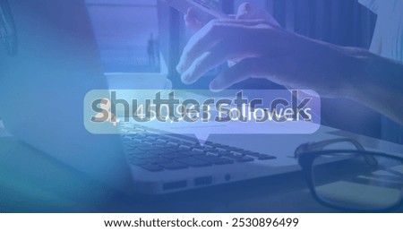 Image of digital interface Followers text and people icon with growing numbers on blue speech bubble over woman using smartphone and laptop. Global social media network digitally generated image.