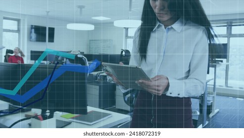 Image of digital interface showing statistics with diverse colleagues working together in an office. Digital interface and global business, digitally generated image