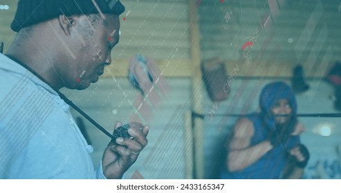 Image of digital interface with statistics scanning and data processing over male boxer with male coach, checking time boxing. Global computer network technology concept digitally generated image.