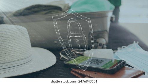 Image of digital padlock and shield over smartphone with qr code, luggage, hat and mask on bed. Digital composite, multiple exposure, protection, security code and travel concept. - Powered by Shutterstock - Get 15% off with code: PIKWIZARD15