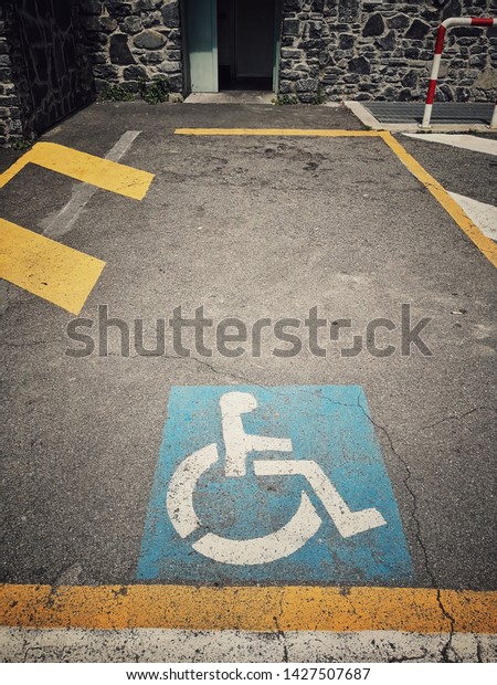 Image of a\
disabled person empty parking\
space.
