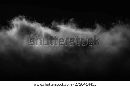 An image displaying a low-lying, blurred mass of white clouds against a dark, solid black backdrop.