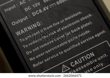 The image displays a clear "WARNING" section with safety instructions for an electronic device.