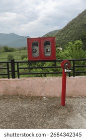 The image displays components of a fire hydrant system, specifically a fire hydrant post and a fire hose cabinet. 