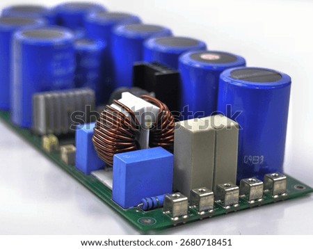 The image displays an electronic component known as a toroidal inductor or a common-mode choke.
