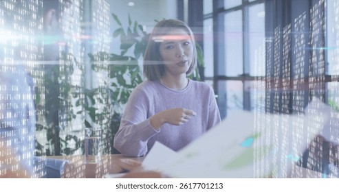 Image of diverse business people talking over data processing. global business, finances, connections and digital interface concept digitally generated image.