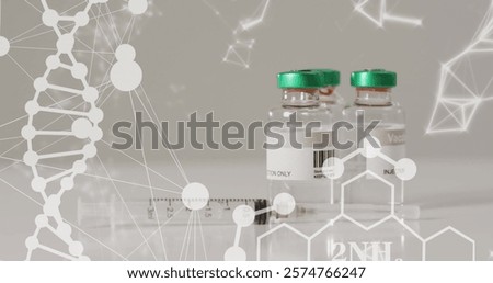 Image of dna, networks and elements over syringe and vaccine vials on grey background. Medical services, research, coronavirus, medicine, healthcare and communication, digitally generated image.