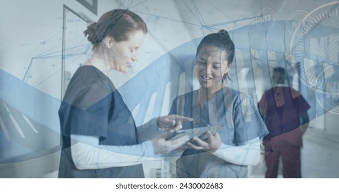 Image of dna strand and data processing over diverse doctos in hospital. Global medicine, healthcare services, connections, computing and data processing concept digitally generated image.