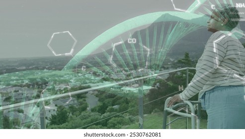 Image of dna strand and data processing over african american senior female patient. Global medicine, connections, computing and data processing concept digitally generated image.
