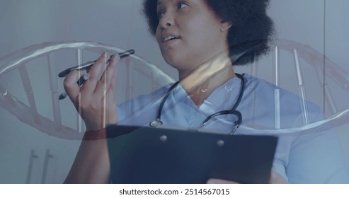 Image of dna strand over african american female doctor talking on smartphone. Global science, medicine, healthcare, lifestyle and digital interface concept digitally generated image. - Powered by Shutterstock