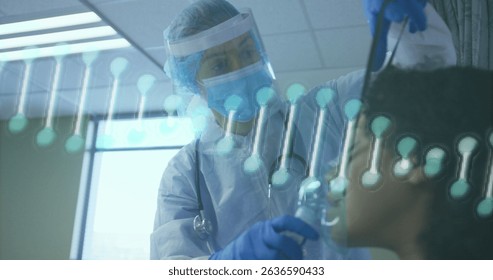 Image of dna strand spinning over doctor and african american patient using oxygen mask. Global medicine, technology, data processing and digital interface concept digitally generated image. - Powered by Shutterstock - Get 15% off with code: PIKWIZARD15