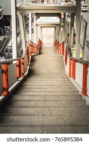 A Image Of Downward Stairs Of The Capital Sky Train Station's Overpass Foot Bridge For The Pedestrian In Bangkok