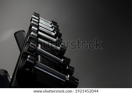 Image of dumbbells and dark background