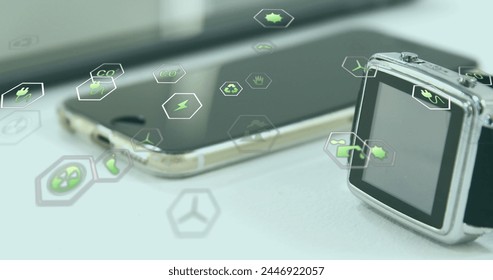 Image of eco icons and data processing over electronic devices. Global business, finances, digital interface, computing and data processing concept digitally generated image.