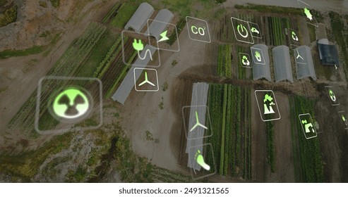 Image of eco icons and data processing over greenhouses and landscape. Global business, digital interface, finances, computing and data processing concept digitally generated image.