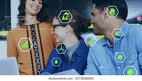Image of ecology icons and data processing over diverse colleagues discussing work in office. Global business, ecology, computing and digital interface concept digitally generated image.
