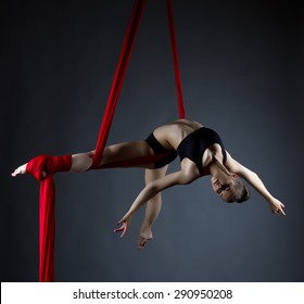 Image of elegant girl doing acrobatic trick 
