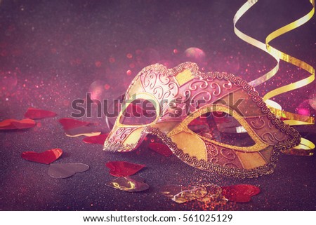 Image of elegant venetian, mardi gras mask on glitter background