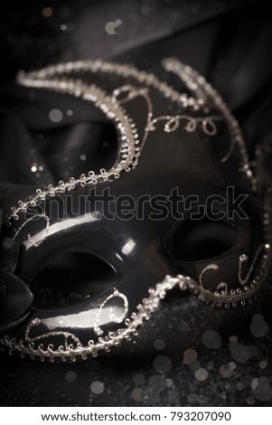 Image of elegant venetian mask over black background