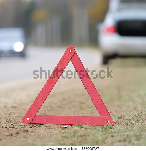 The image of an\
emergency sign on a road