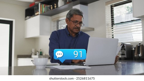 Image of emoji icons over man using laptop. Global business networks data processing technology and digital interface concept digitally generated image.