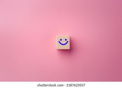 Image Of Emotions On Positive Wooden Blocks. Joy, Calm, Anger. Pink Color Background.